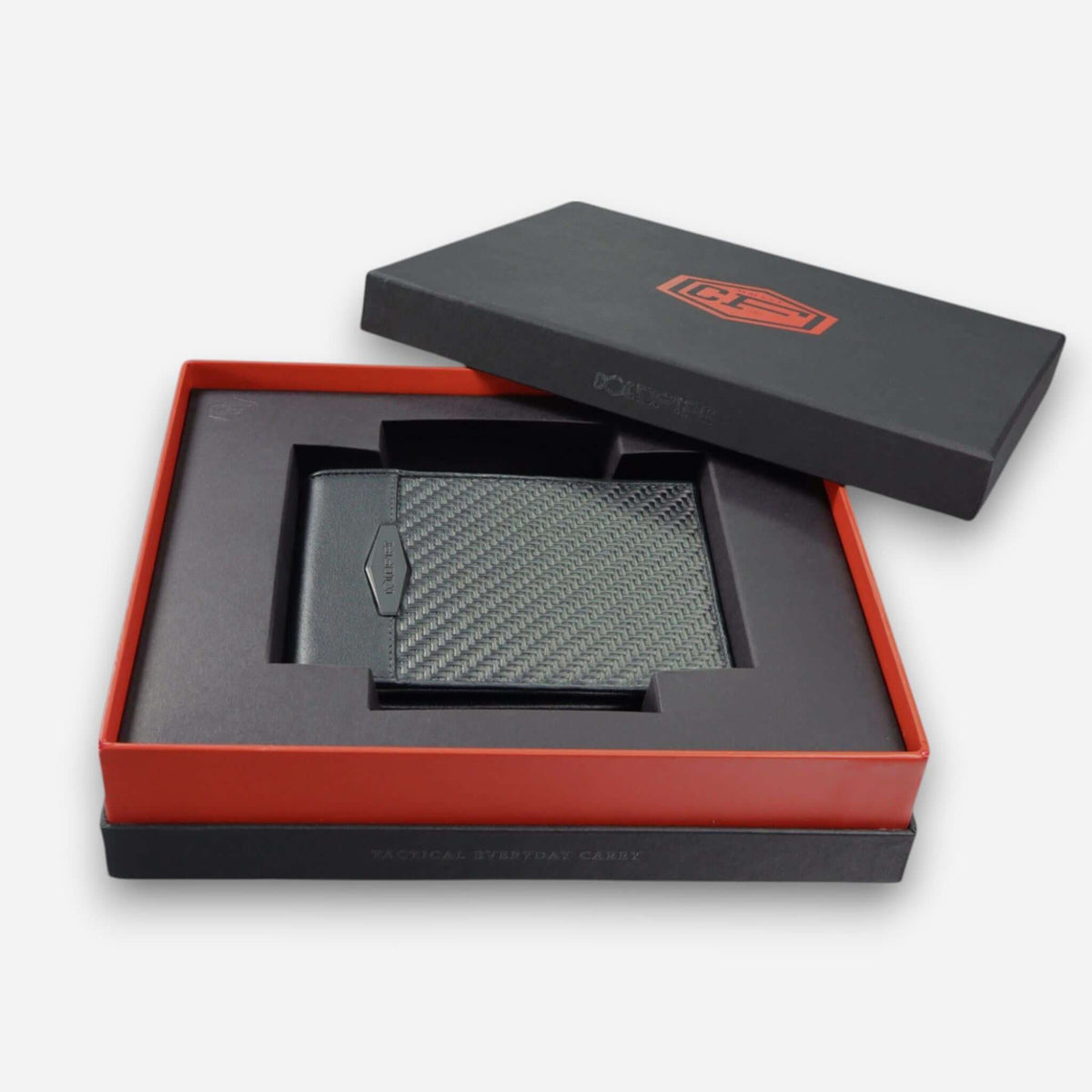 COLDFIRE Strike Core carbon fiber wallet in its presentation gift box with custom-fit cradle