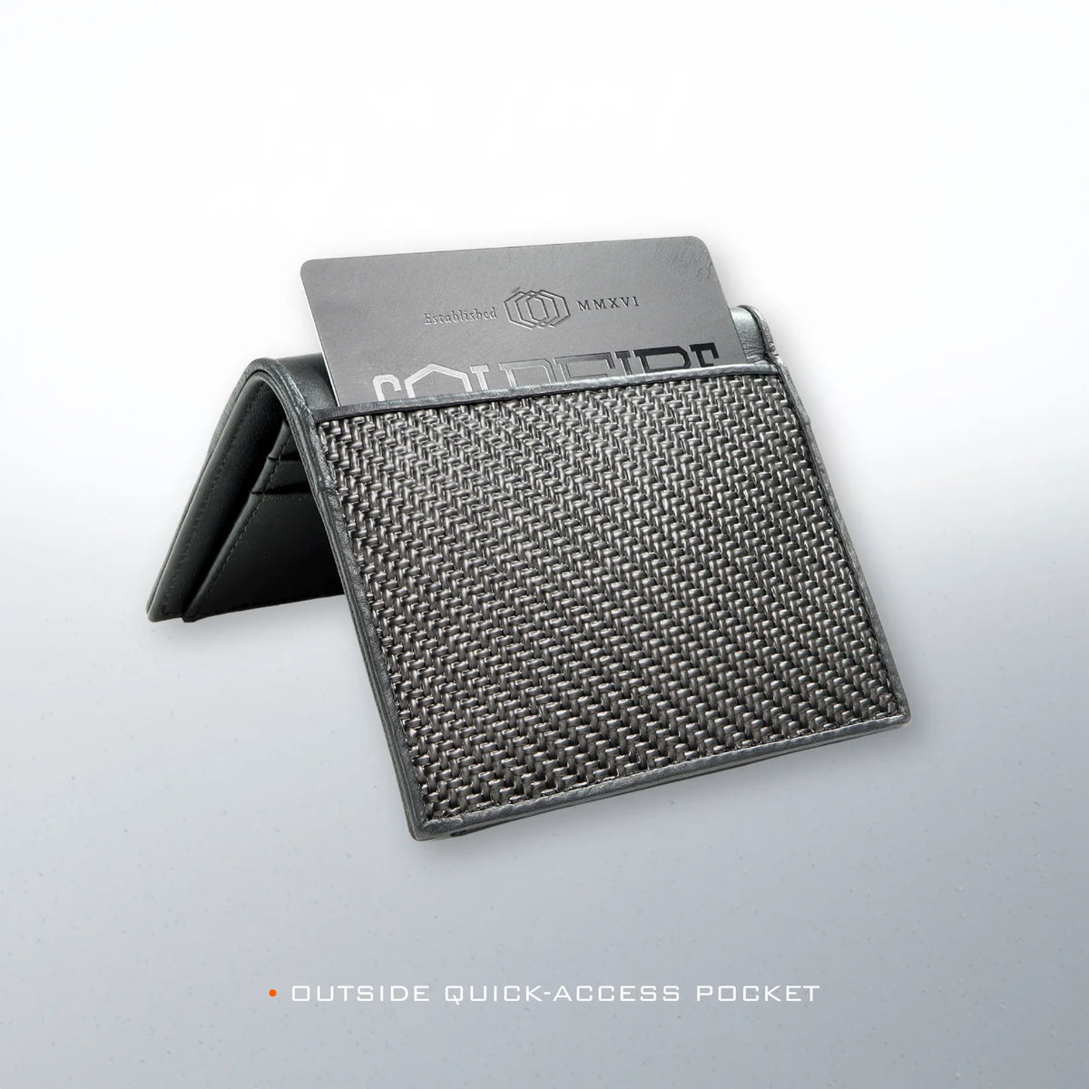 COLDFIRE Flex wallet outside quick-access pocket holding a COLDFIRE metal card, woven flexible carbon front panel