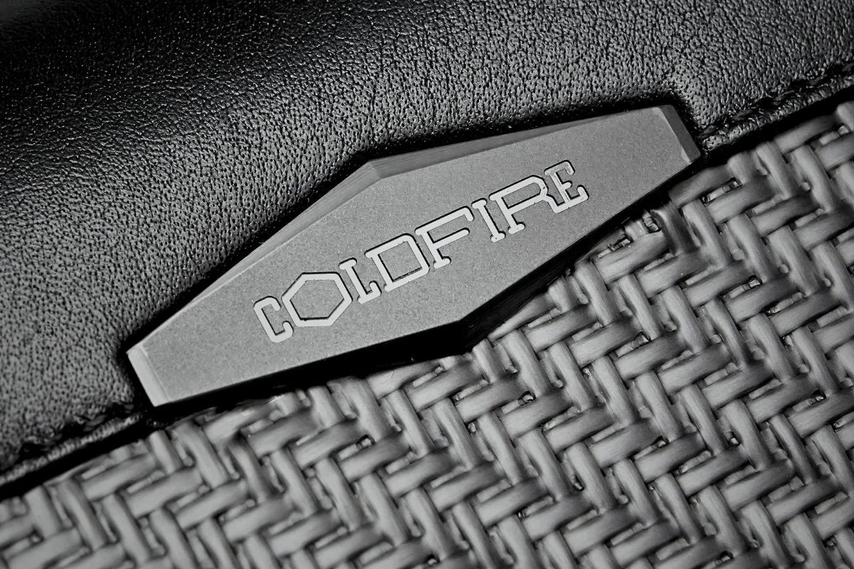 COLDFIRE Ti-6Al-4V titanium badge on carbon fiber and K-Leather — aerospace grade hardware